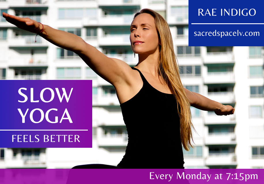 rae indigo doing yoga pose in front of apartment building